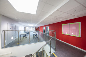 Photo of a staircase and corridor inside the Leigh Academy Blackheath building.