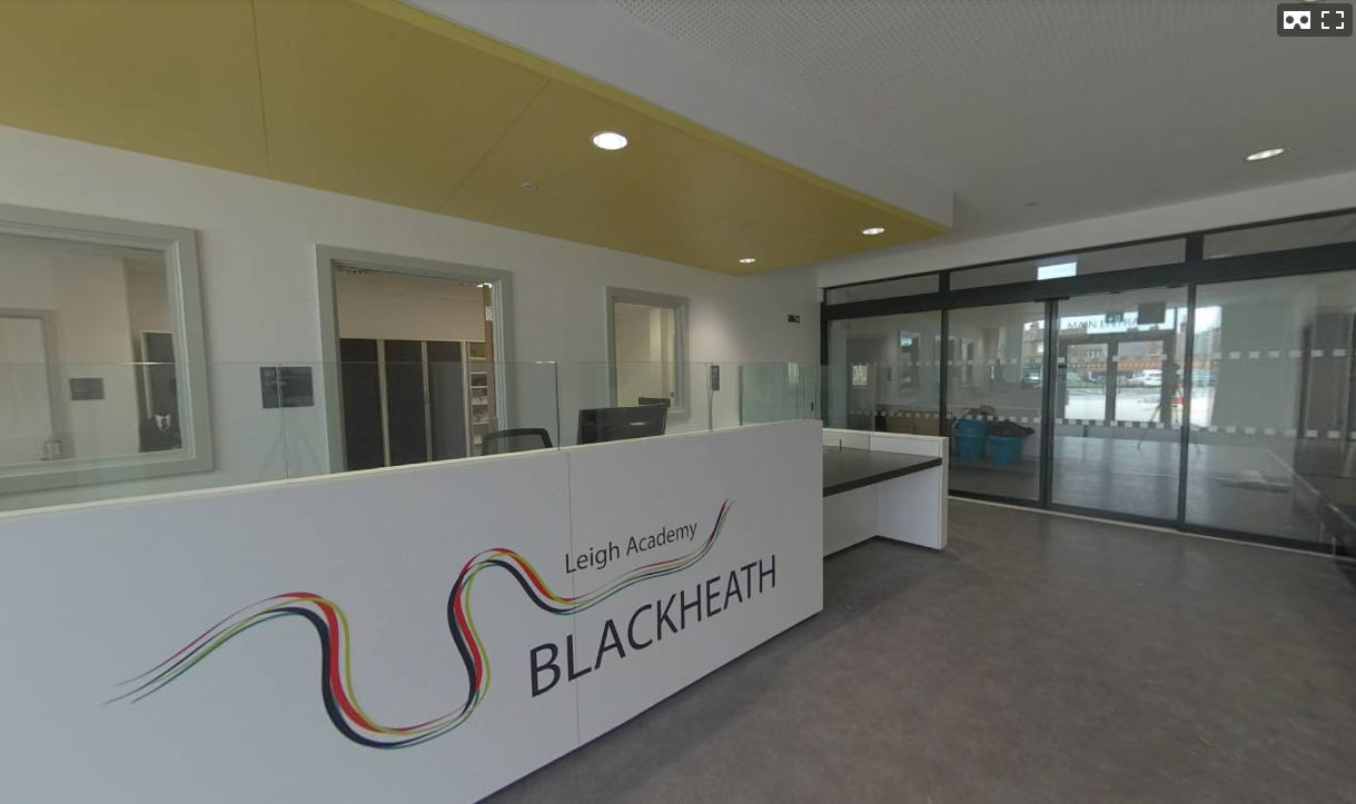 Photo of the main Reception desk at the entrance to the Leigh Academy Blackheath building.