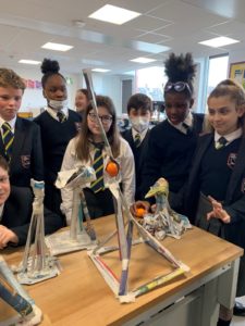 Year 7 seen observing their work building towers from papier mache.