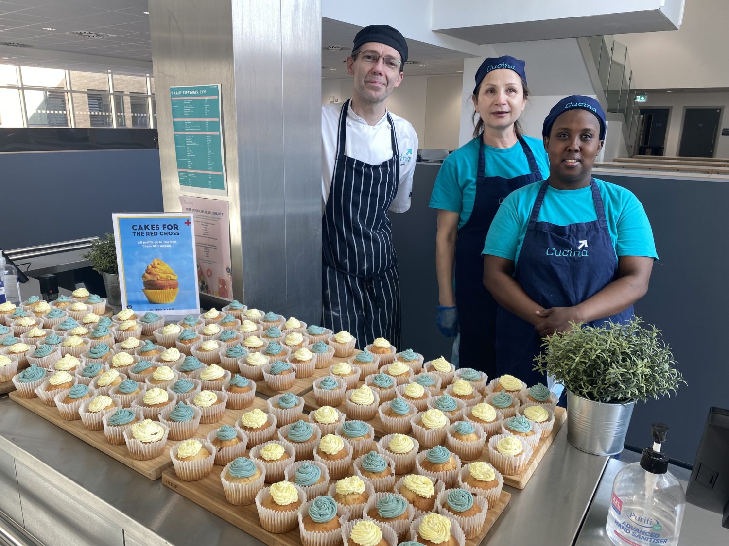 Cucina staff stood with their bake sale cupcakes