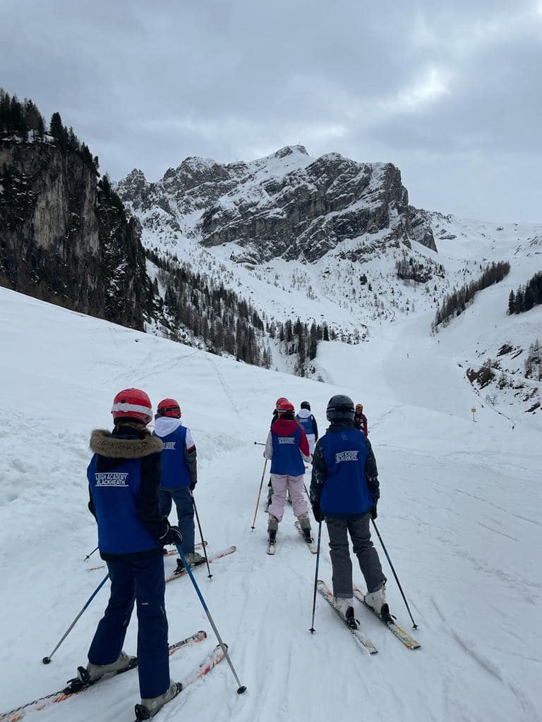 A small group of LAB students are pictured skiing on the snow during a trip to Austria.