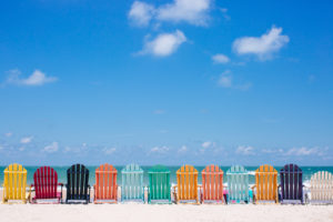 Beautiful color chairs on the beach on the summer vacation