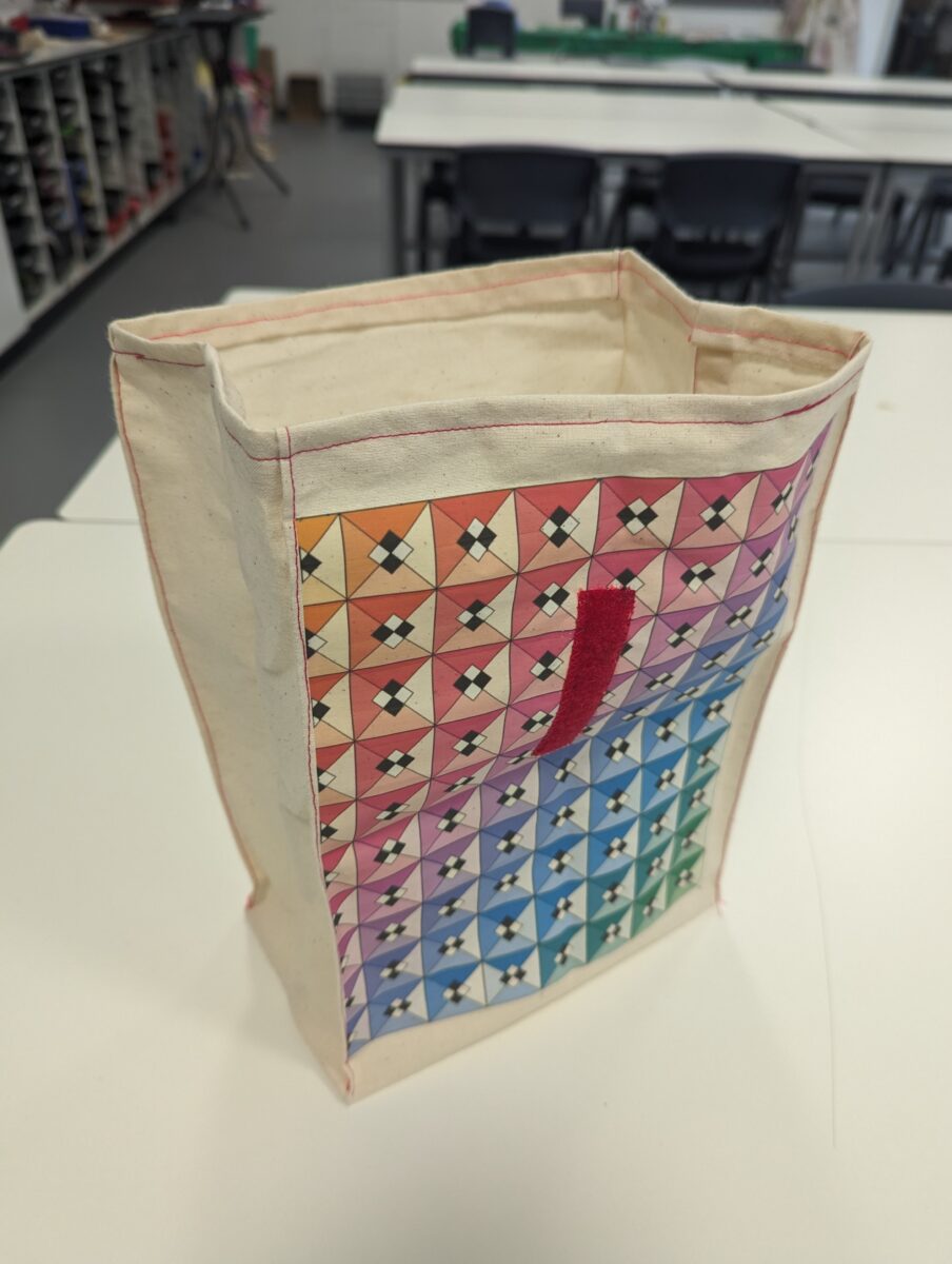 DT Year 8 Students Lunch Bag - a brown canvas bag with a rainbow geometric pattern