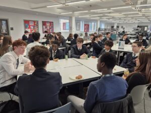 Students sat at desks talking